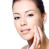 Woman touching cheek